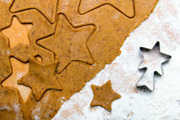 Preparing Christmas gingerbread cookies. Gingerbread dough and star shape cookies ingredients.