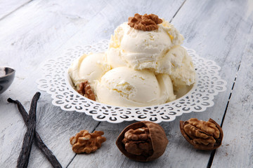 homemade oatmeal and walnut ice cream on wooden background
