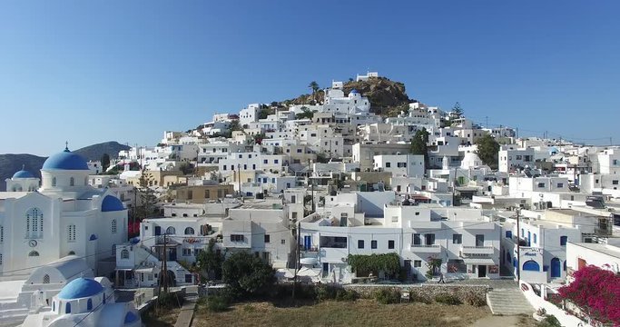 flight over the town of Ios with its beautiful white houses and churches