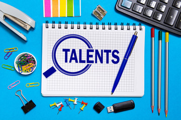 Notebook with notes  search for talented employees, programmers . The concept is searching for talented personnel.