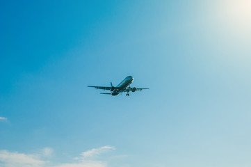 Fototapeta na wymiar Passenger airplane against blue sky