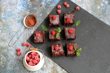 Homemade brownies with dark chocolate and raspberries