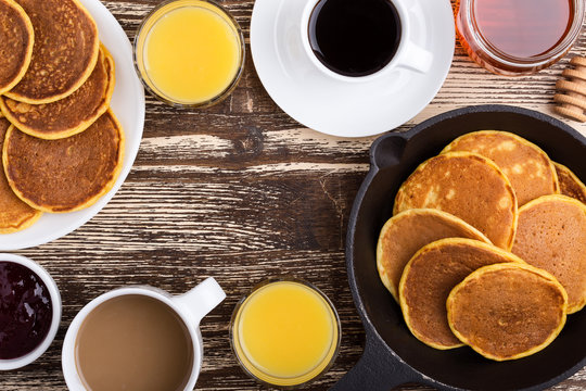 Pumpkin pancakes breakfast or brunch. Table viewed from above