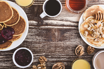 Pumpkin and  buttermilk pancakes breakfast or brunch. Table viewed from above