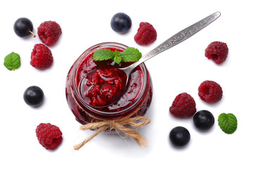 raspberry jam with raspberry berries isolated on white background. top view