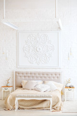 Luxurious bedroom with bed and bedside tables. Copy space. Concept interior, home, comfort, hotel.