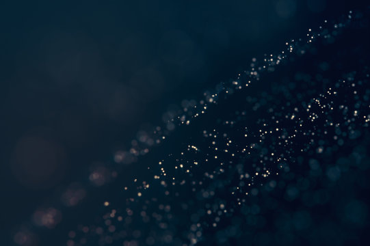 Glitter lights defocused background. Bokeh dark illustration