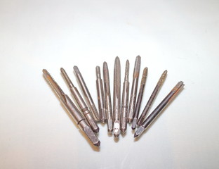 Tool for threading in holes and stilettos on a white background