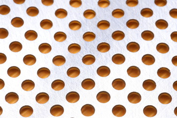 Abstract background of metal surface with holes