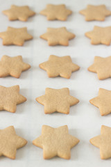 Gingerbread star cookie for Christmas on white background.