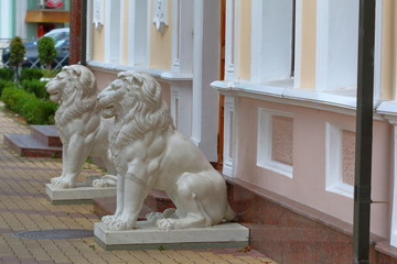 Two old white marble statue of lions. Kislovodsk, Russia