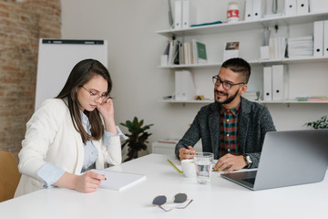 Company recruiter evaluating candidate's abilities at a job interview