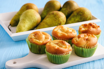 Homemade sweet muffins with pear stuffing.
