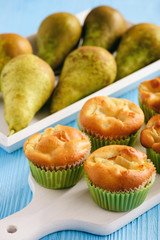 Homemade sweet muffins with pear stuffing.