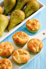 Naklejka na ściany i meble Homemade sweet muffins with pear stuffing.