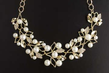 golden necklace with pearls isolated
