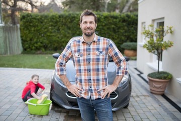 Obraz premium Man standing near the car