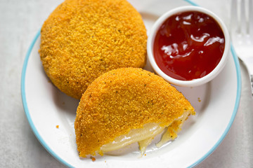 Breaded mozzarella with tomato dip