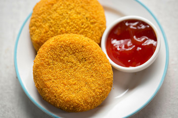 Breaded mozzarella with tomato dip