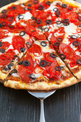 fresh and delicious Italian pizza on a wooden table