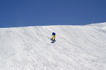 Fototapeta na wymiar Snowboarder downhill in terrain park at ski resort