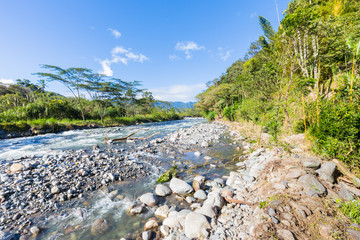 Panama Boquete district Caldera creek in the jungle with blue sky in a sunny day panoramic view