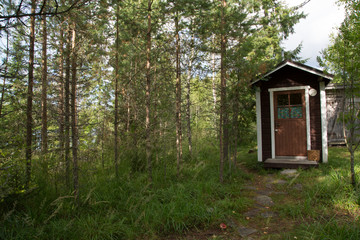 Fototapeta na wymiar Composting toilet in the nature, typical outhouse in Finland 