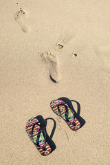 Fototapeta na wymiar flip flops on the beach 