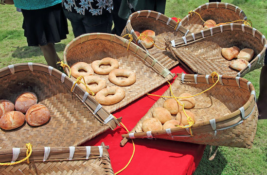 Popular breads of Goa, India, such as pao, kankan, undo and poie, made by Poder, the traditional bread makers and placed in traditional cane trays made by the Mahar community.
