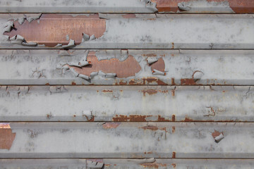Detail of ruined rolling shutter with grunge effect closed