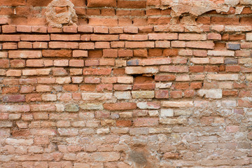 Old red brick wall destroyed useful background or texture