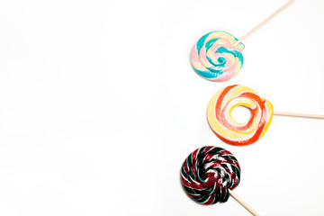 New Year's colorful sweets on a white background. Empty space