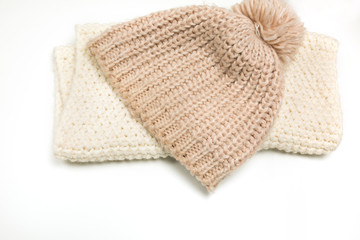 Fototapeta na wymiar Knitted hat and scarf isolated on white background