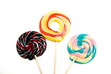 Colorful caramel candies on a white background