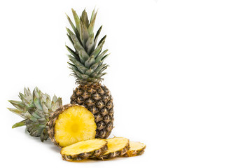 pineapple fruit with slices isolated on white background