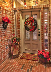 Fototapeta na wymiar festive Christmas holiday decorations in entryway of home, welcoming mood