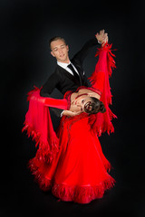 dance ballroom couple in a dance pose isolated on blackbackground