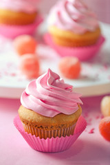 Delicious cupcake on table