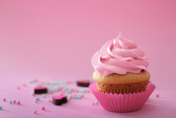 Delicious cupcake on color background