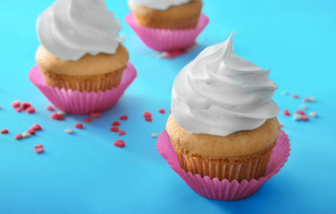 Delicious cupcake on table