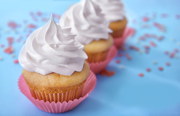 Delicious cupcake on table