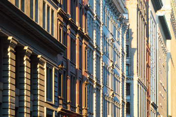 New York City historic style architecture buildings with warm glow of sunlight