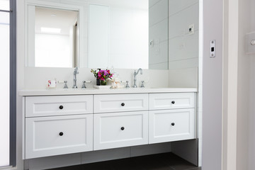Fototapeta na wymiar Wall hung vanity in a luxury Hamptons styled bathroom