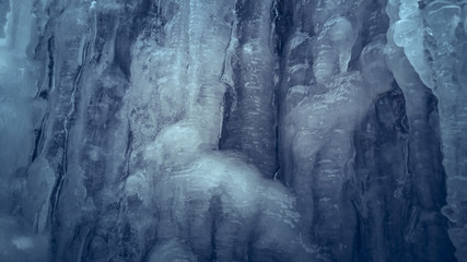 Fototapeta na wymiar Detail of slippery ice wall. Frozen water pattern.
