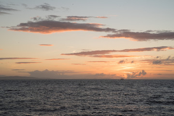 Landscape view of the ocean at Giant's Causeway in Ireland during sunset. 