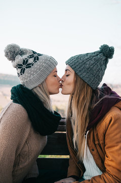 Two women kissing