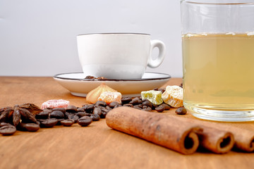 Green tea and coffee on wooden background