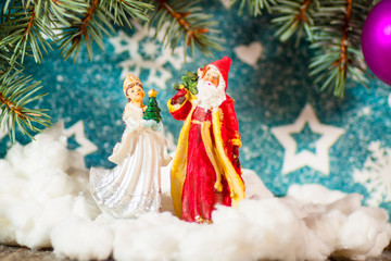 Christmas card background Santa Claus and Snow Maiden Russian Christmas characters: Ded Moroz Father Frost and Snegurochka Snow Maiden with gifts bag