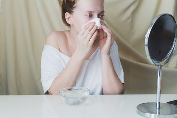 Beautiful young woman is preparing skin for hydrating bubble mask