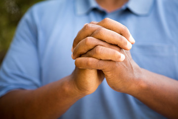 Man in deep thought in prayer and worship.